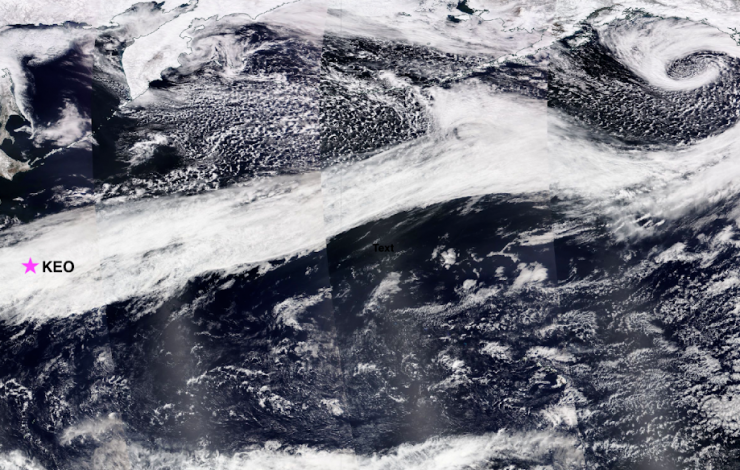 Satellite image stitched together showing the Pacific Ocean with an atmospheric river (shown as a river of white cloud cover) across the North Pacific Ocean