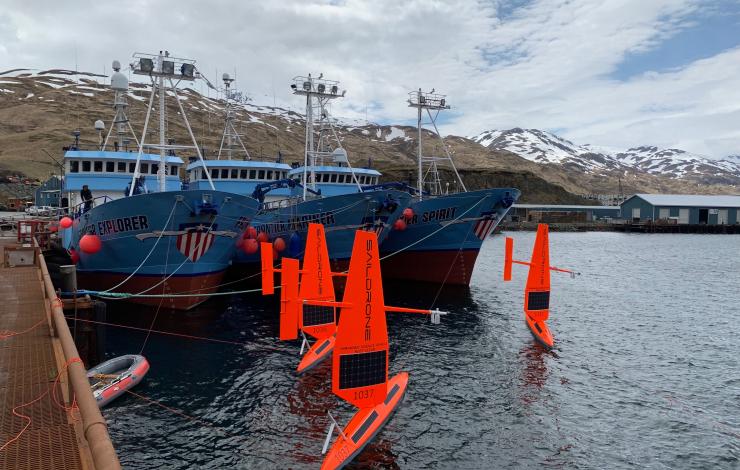 Three of six saildrones getting ready for deployment from Dutch Harbor, AK, on the 2019 Arctic mission